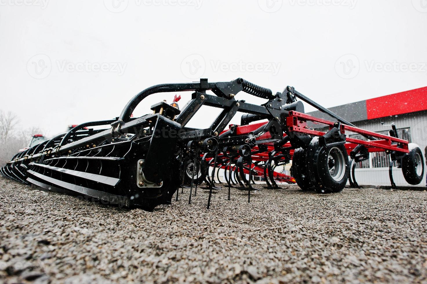 New red agricultural seeder close up view photo