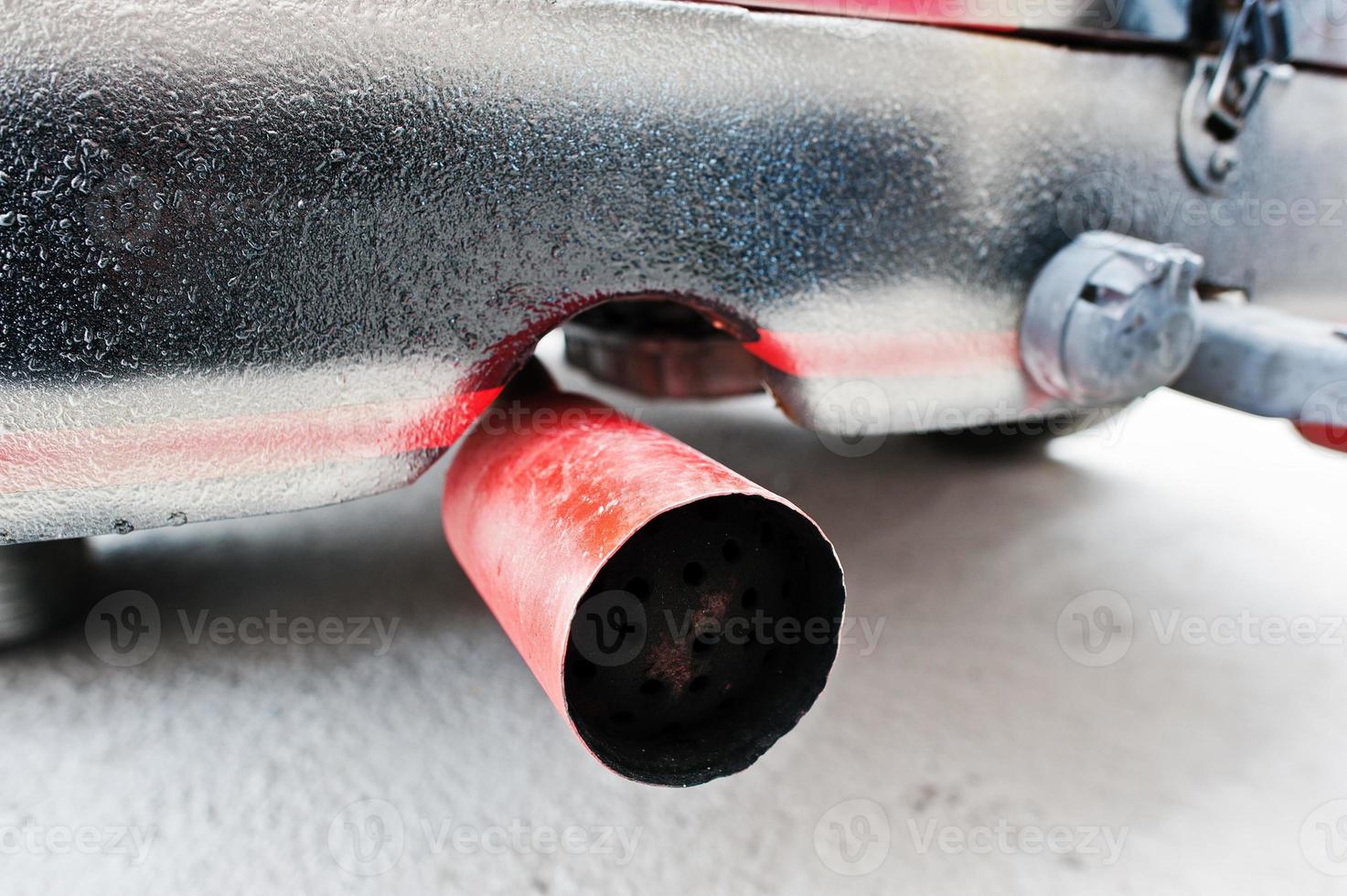 Closeup exhaust pipe of old vintage car photo