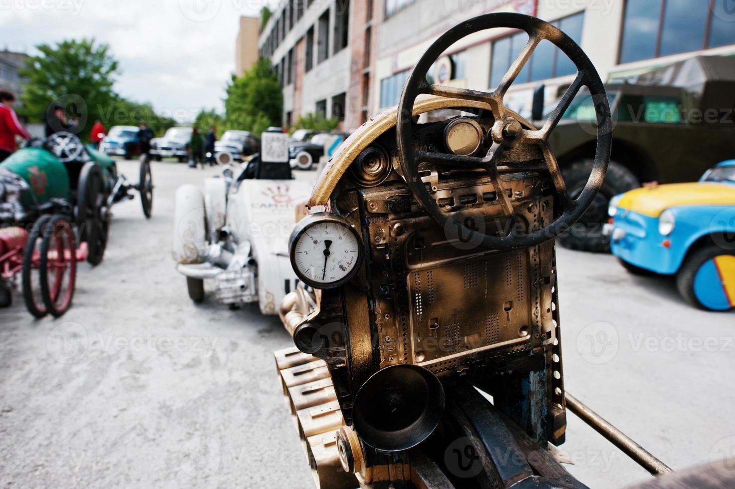 Iron handmade steering wheel at vintage sport car photo
