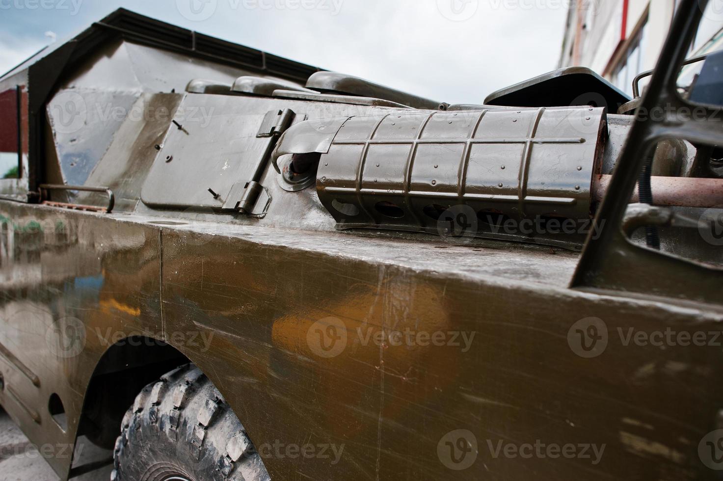 Close up exhaust on armored military car. photo