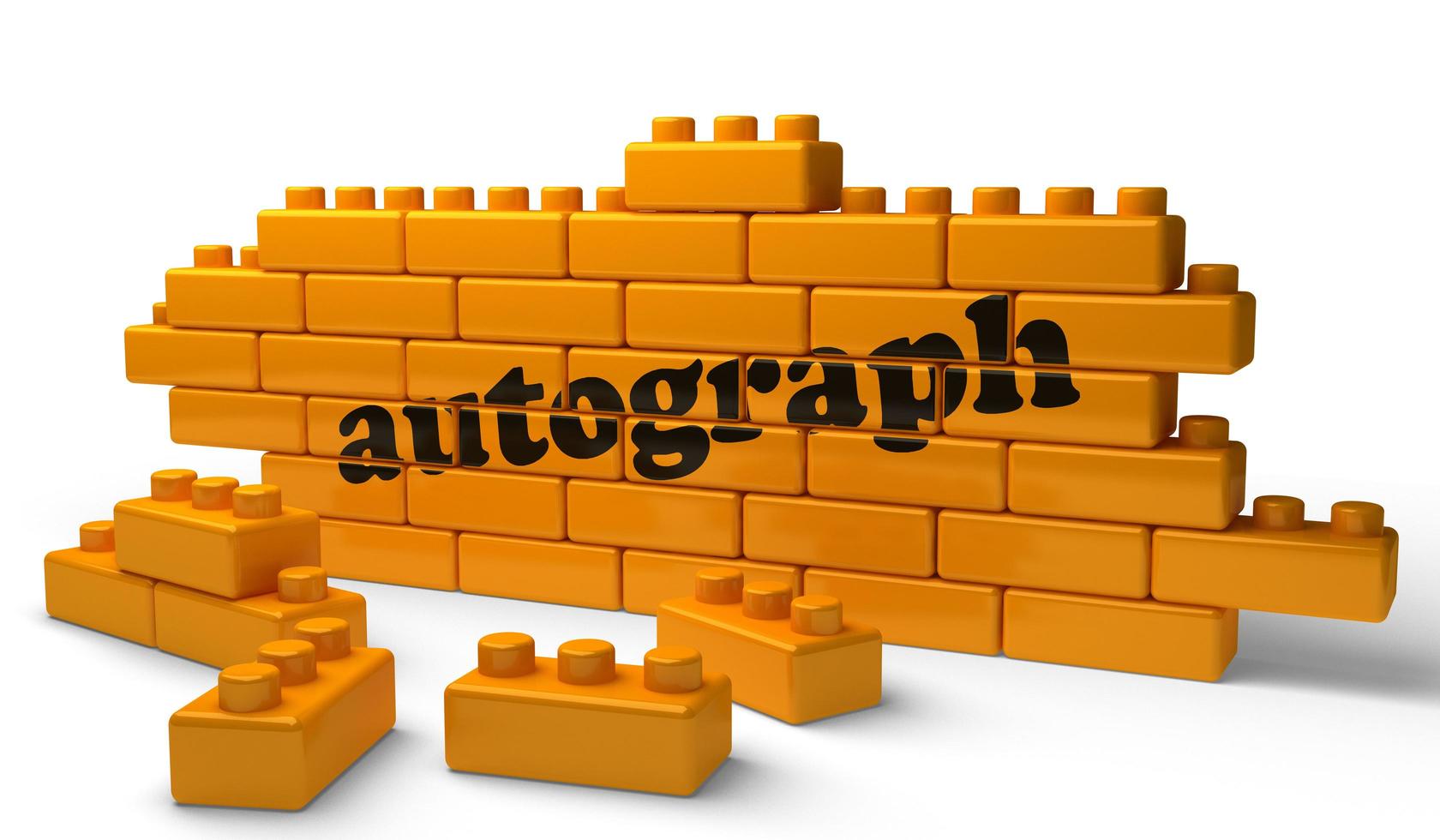 autograph word on yellow brick wall photo