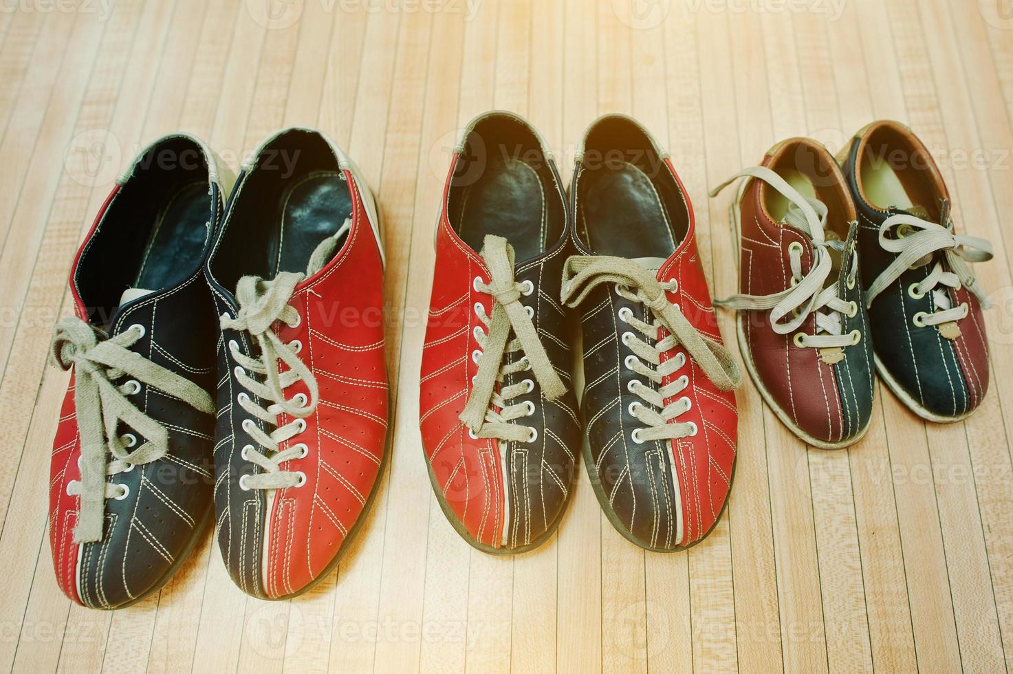 Three pairs of shoes for bowling photo