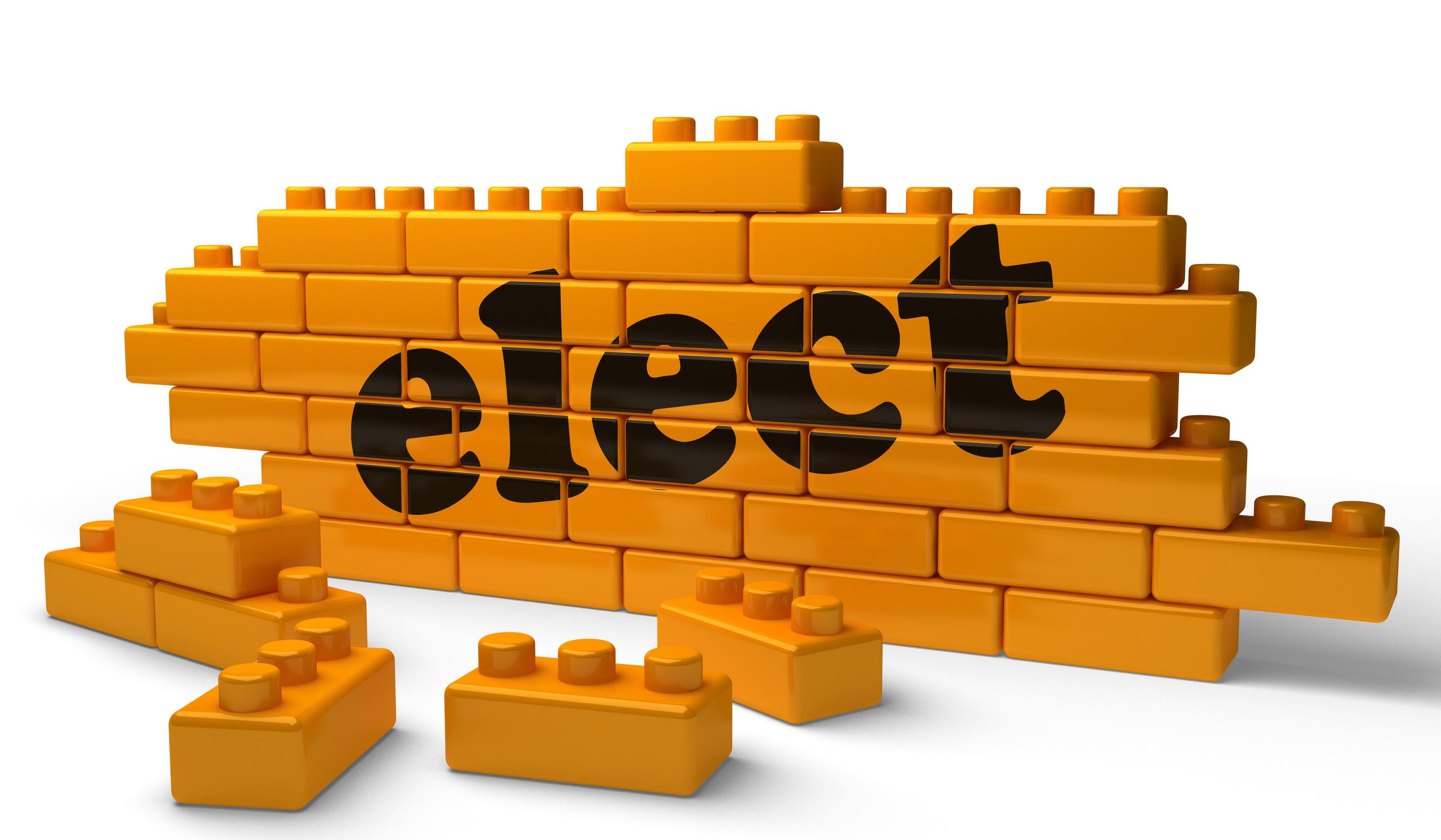 elect word on yellow brick wall 5976256 Stock Photo at Vecteezy