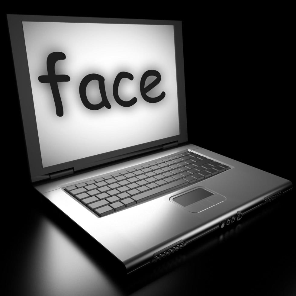 face word on laptop photo