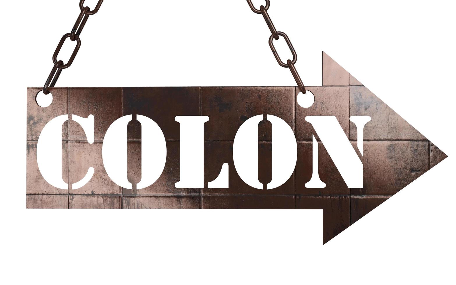 colon word on metal pointer photo