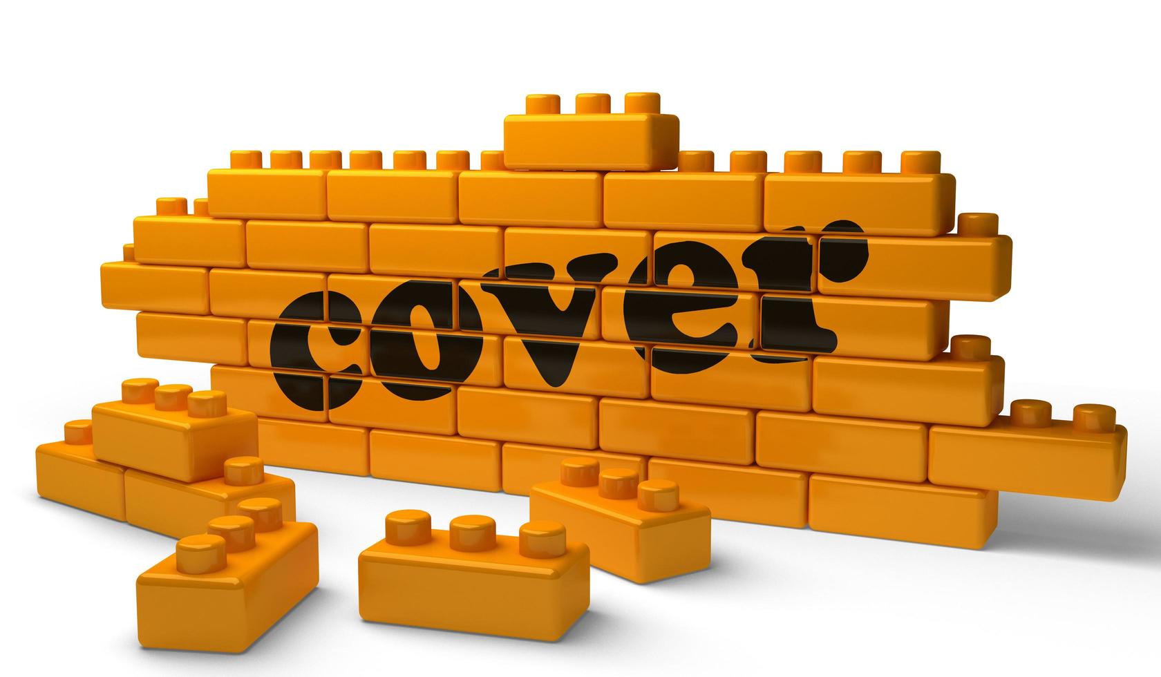 cover word on yellow brick wall photo