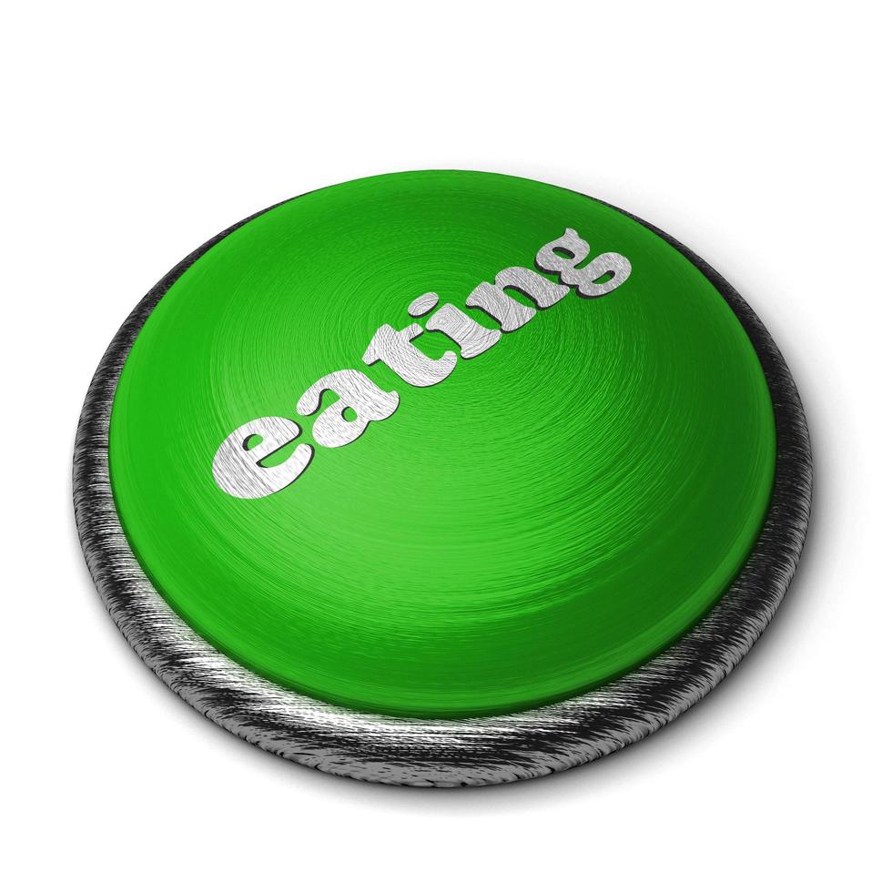 eating word on green button isolated on white photo