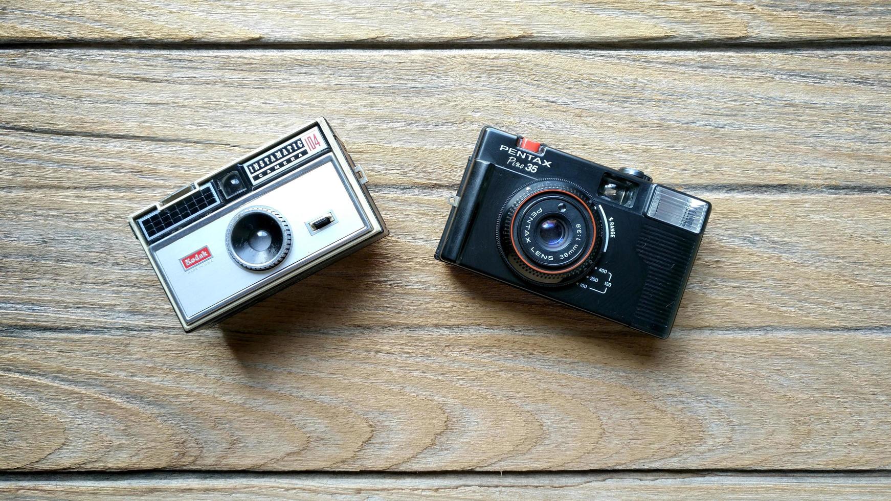 BANGKOK, THAILAND - April 10, 2019. Kodak instamatic 104 and Pentax Pino 35 photo