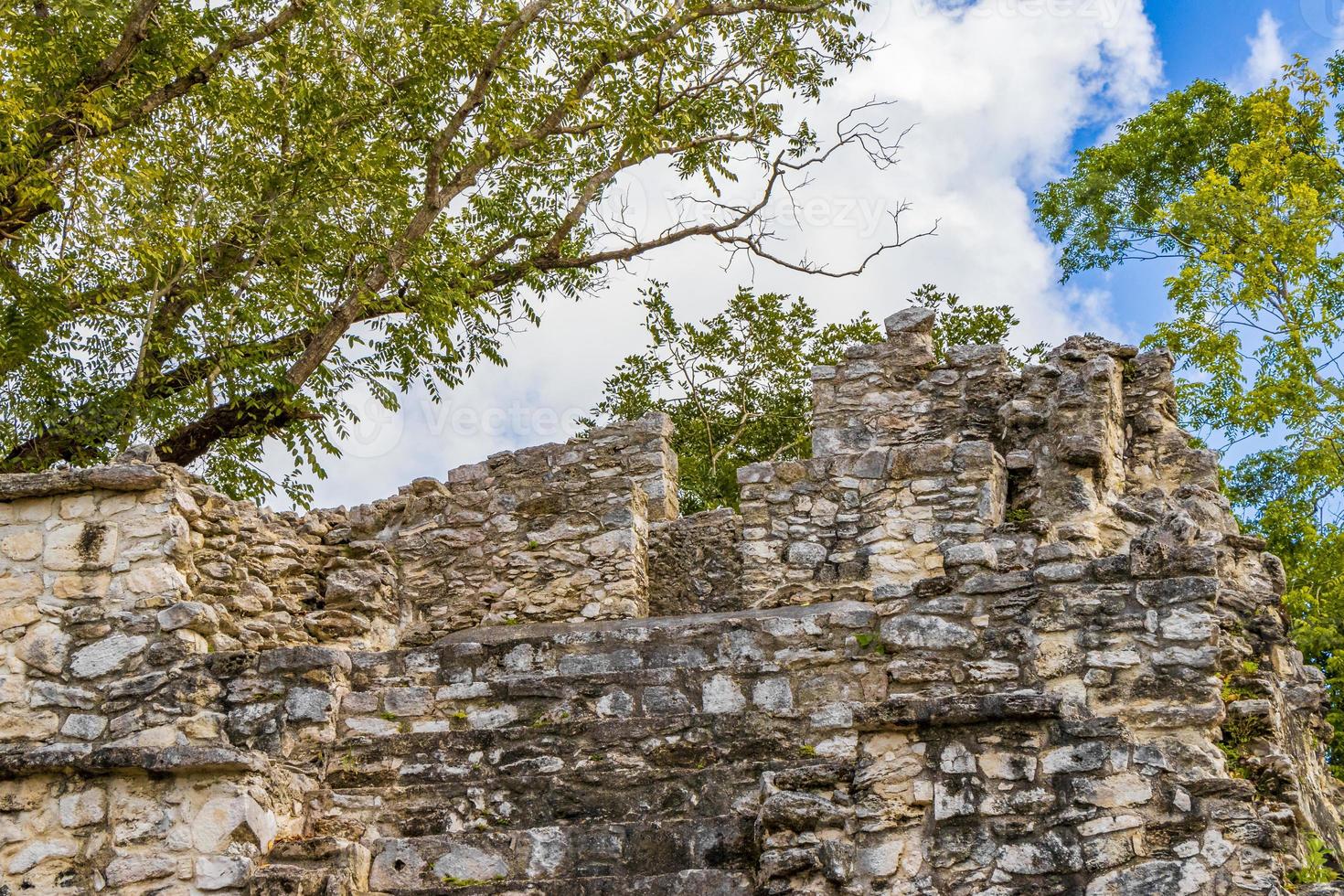 Ancient Mayan site with temple ruins pyramids artifacts Muyil Mexico. photo