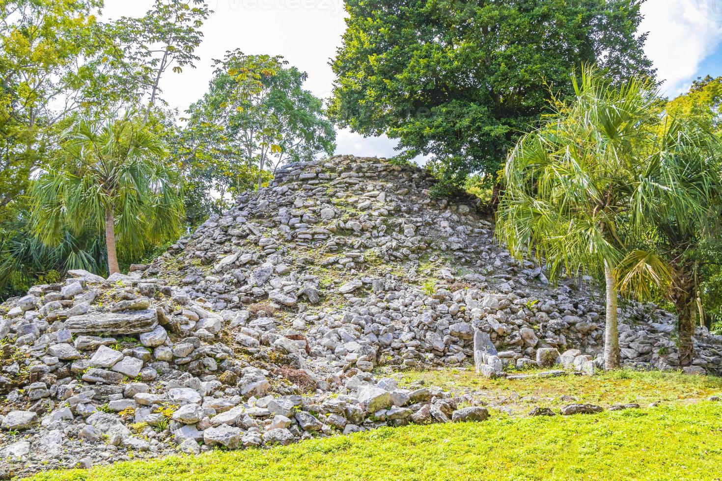 Ancient Mayan site with temple ruins pyramids artifacts Muyil Mexico. photo