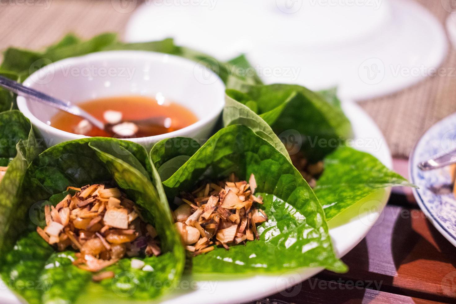 Miang kham or Savoury leaf wraps is a traditional Southeast Asian snack from Thailand 6000805