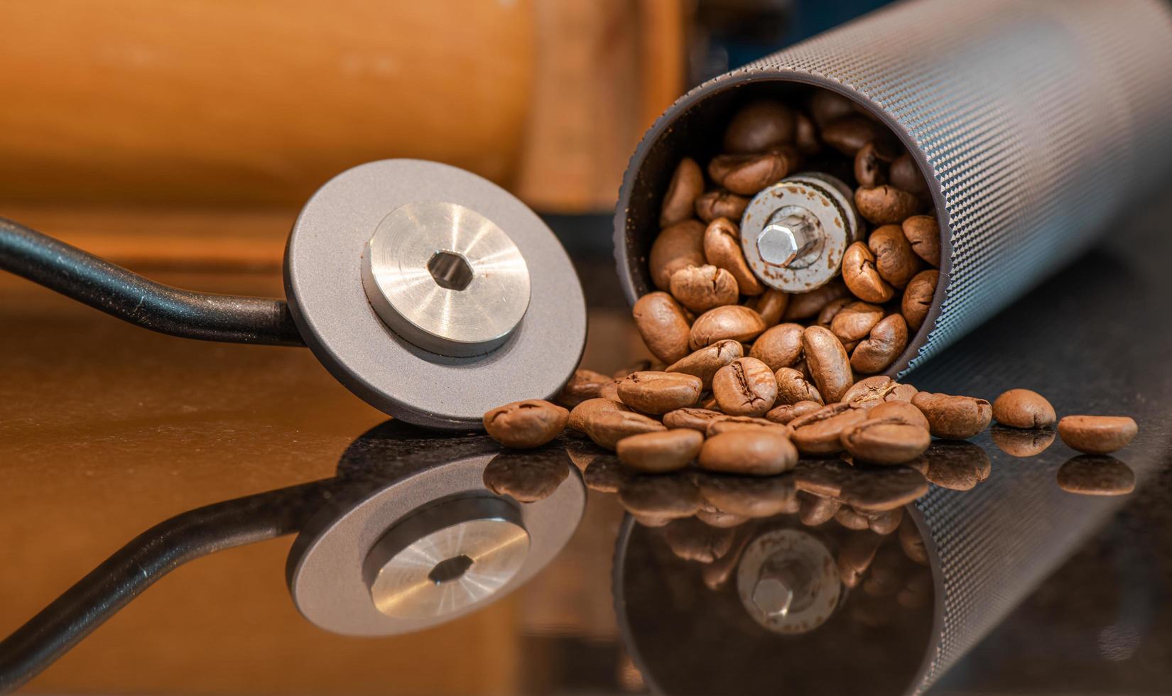 The barista is preparing coffee beans and dripping equipment. photo