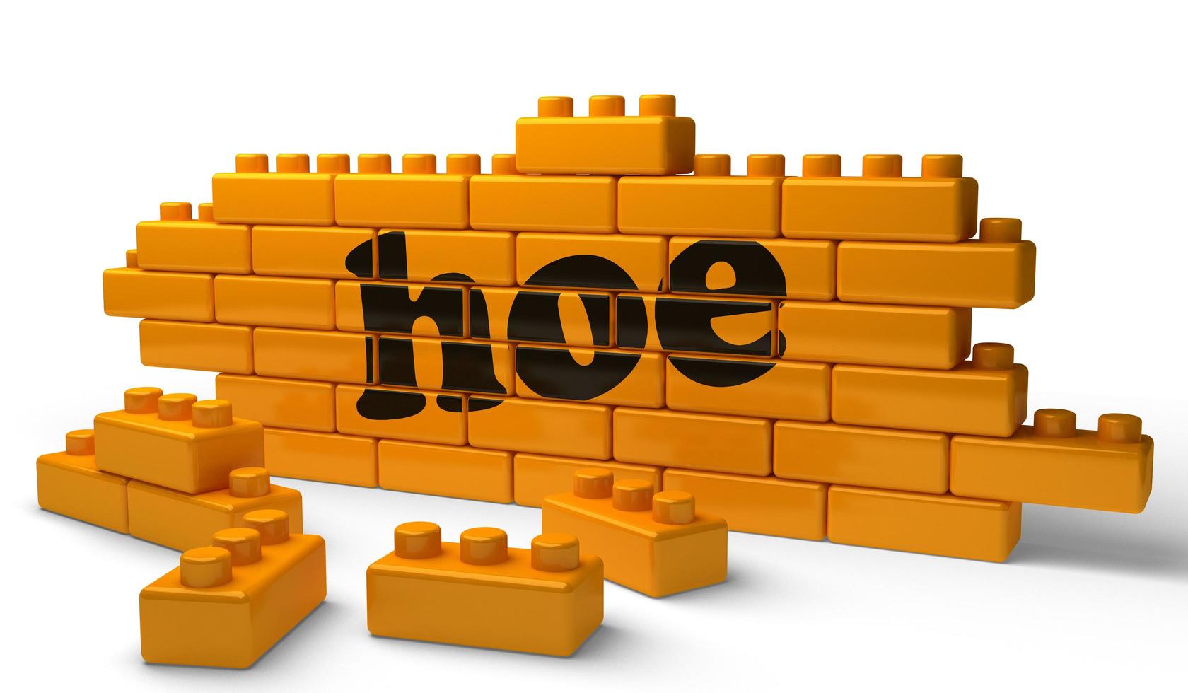 hoe word on yellow brick wall photo