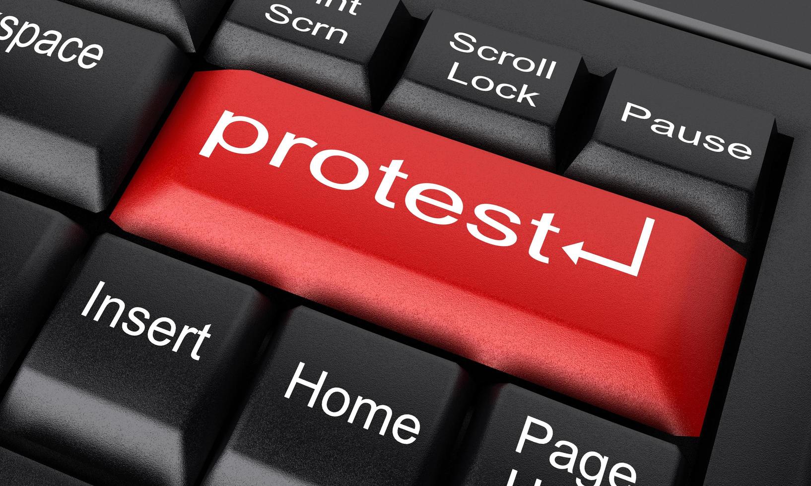 protest word on red keyboard button photo