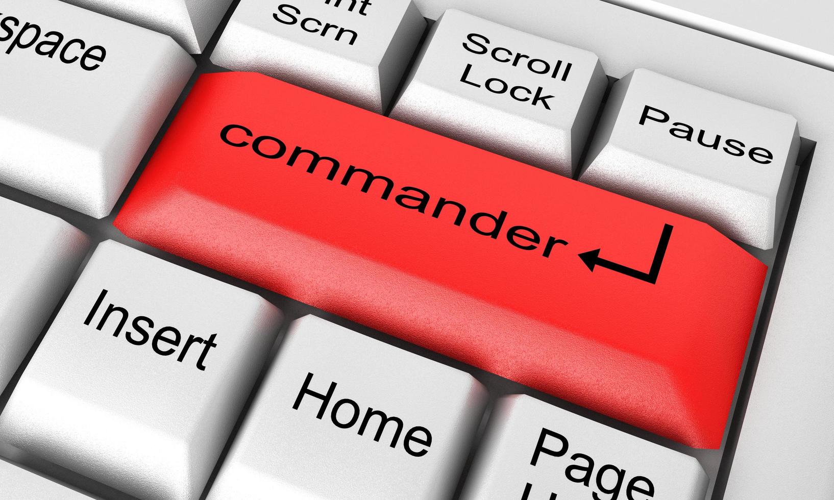 commander word on white keyboard photo