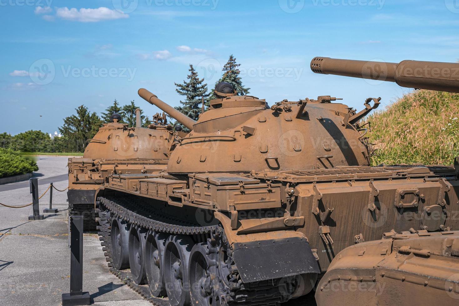 Row of rusty military tanks displayed at museum of victory park photo