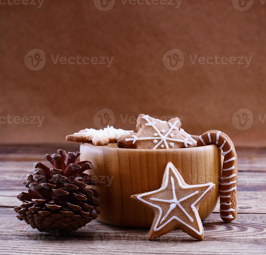 Knar and christmas food sweet cookies on wooden table background. Copy space. Selective focus. Happy new year concept. photo