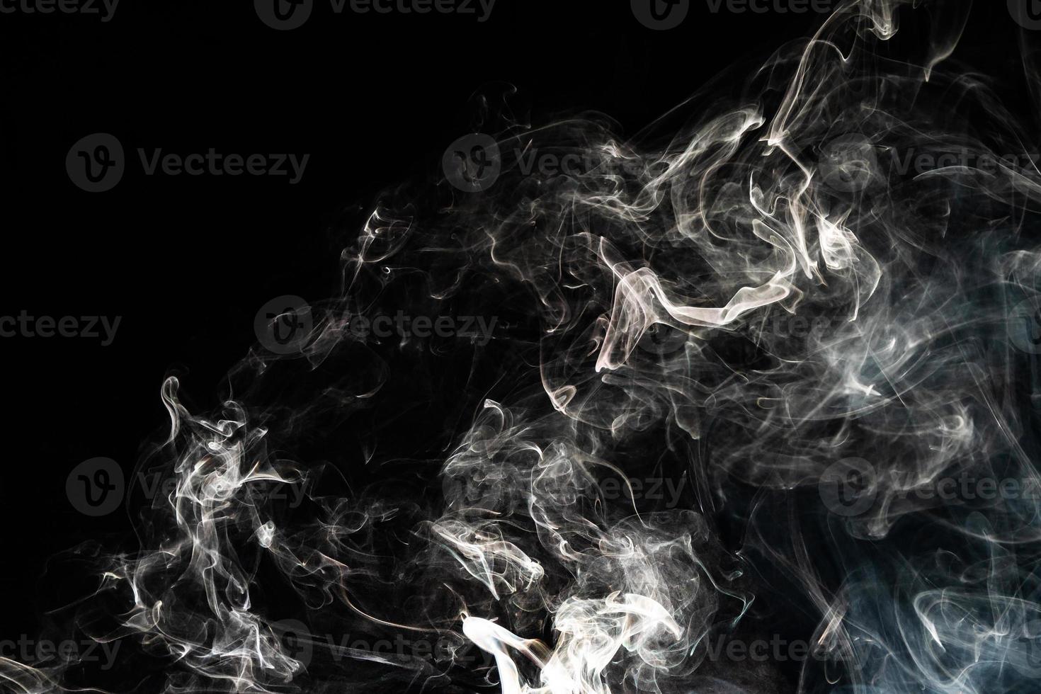 Smoke effect texture. Isolated background. Black and dark backdrop. Smokey fire and mistic effect. photo