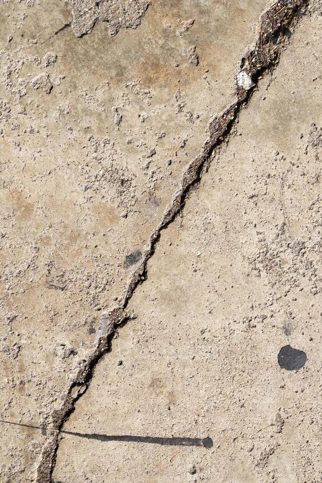 Cracked and abstract grunge texture. Aged material surface backdrop. Weathered effect pattern. Old and dirty background. photo