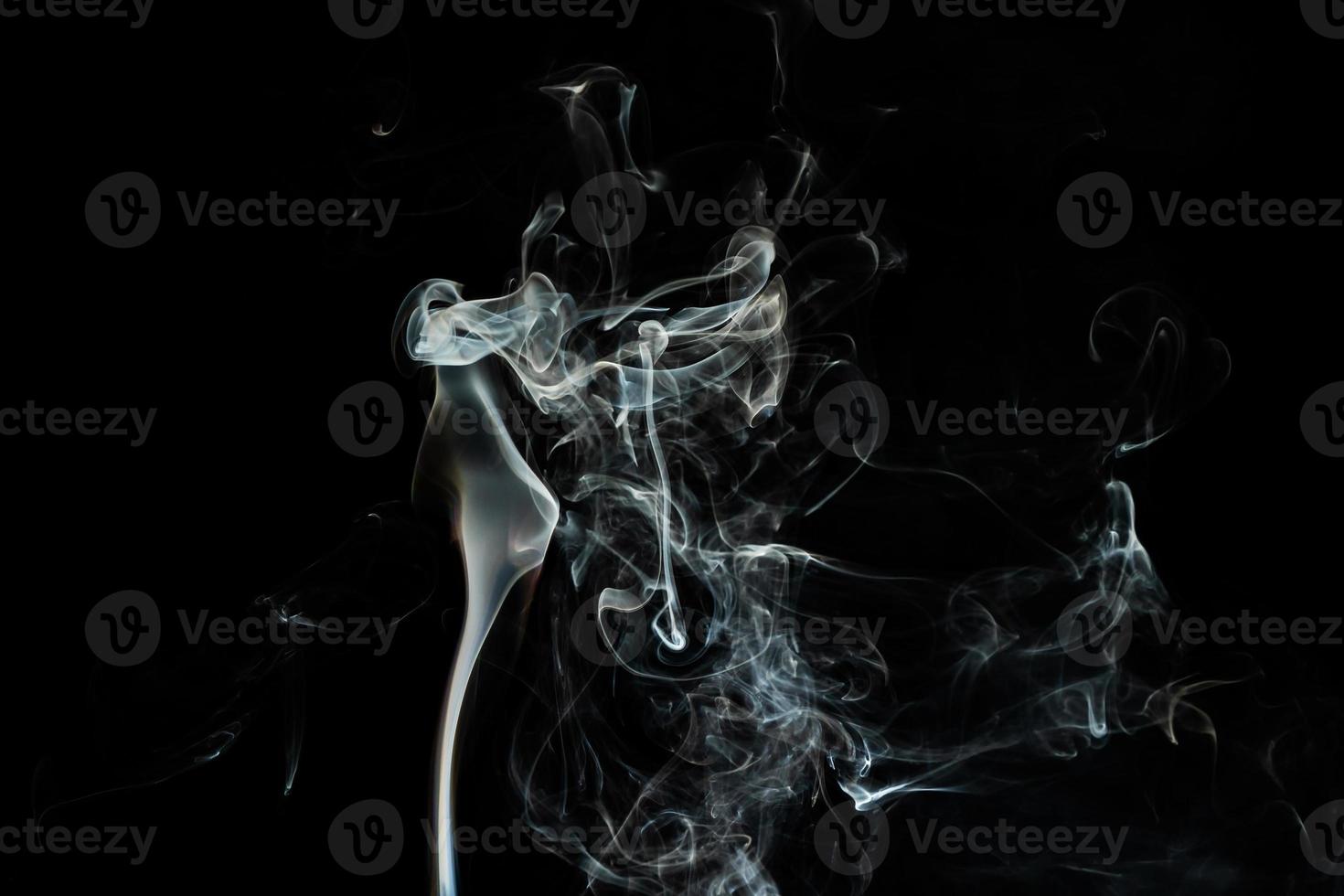 Smoke effect texture. Isolated background. Black and dark backdrop. Smokey fire and mistic effect. photo