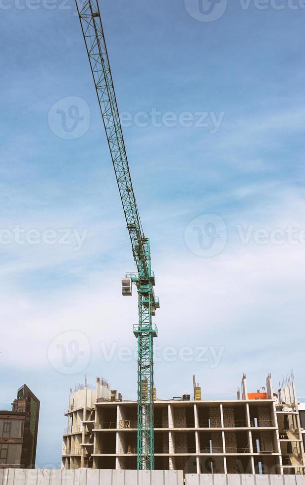 Construction crane building new building outdoor. Urban story photo