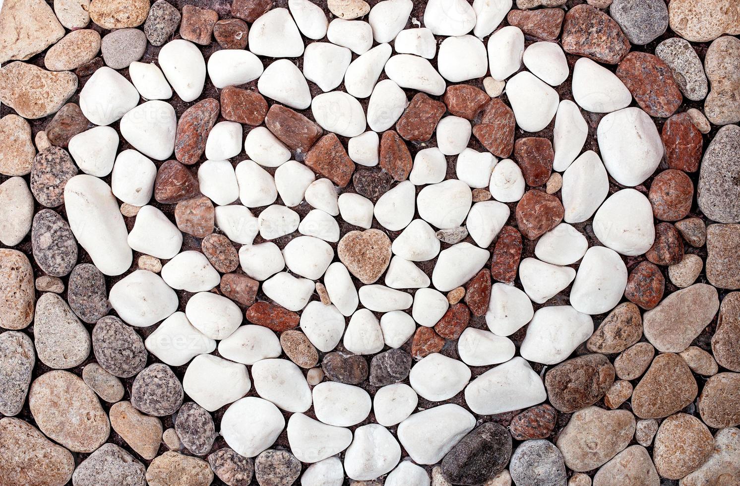 texture, background of sea stones in heart form photo