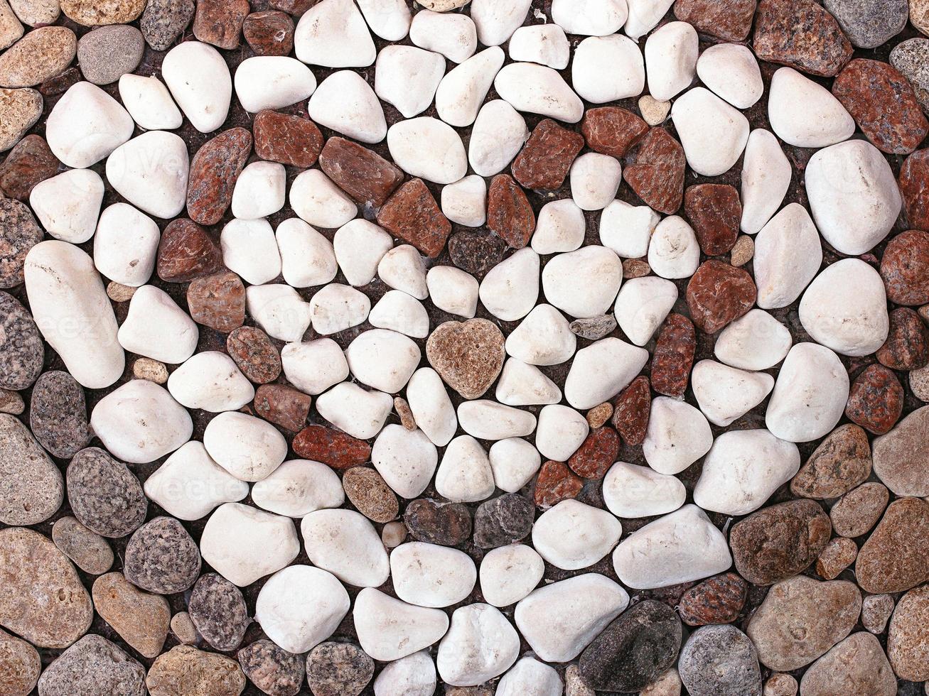 texture, background of sea stones in heart form photo