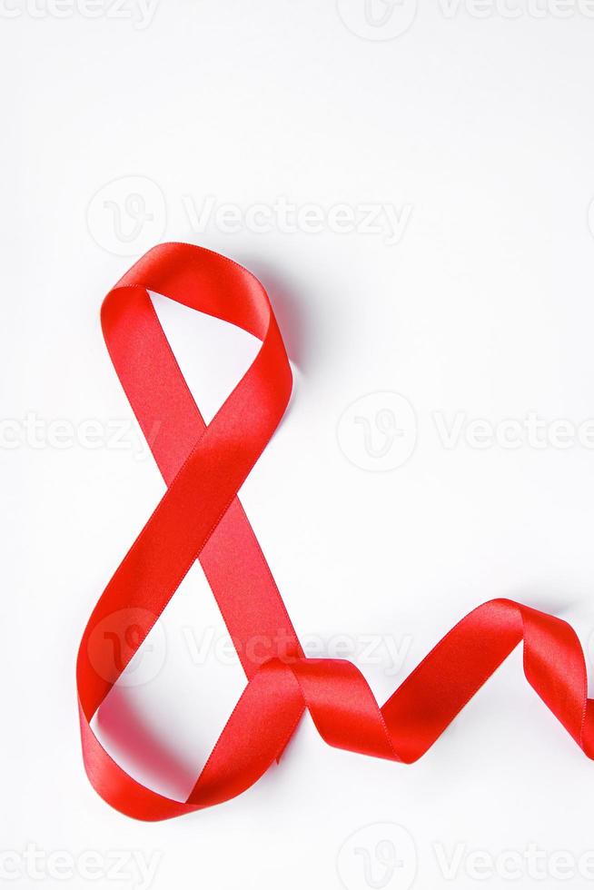 Number 8 from red silk ribbon on a white background. International women's day symbol. Spring holiday on March 8. photo