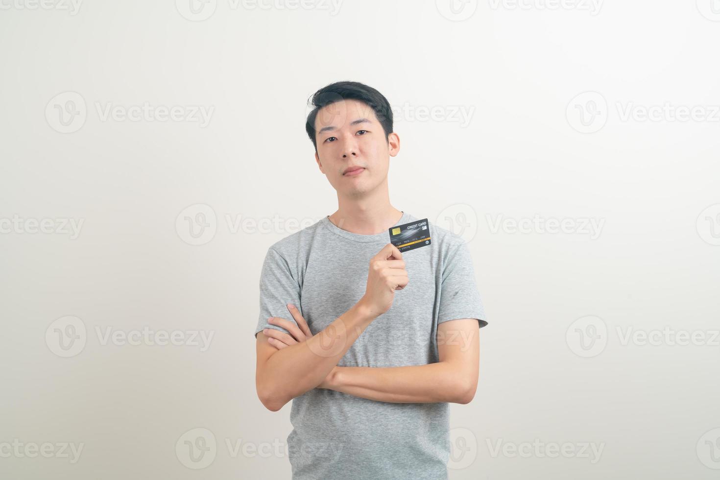 young Asian man holding credit card photo