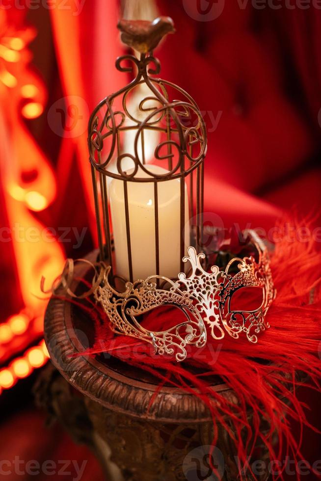 burning candles on a dark night in a wooden lantern photo