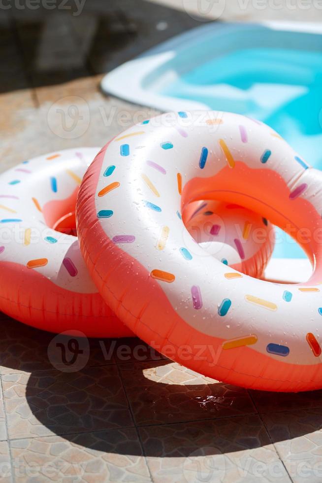 two bright inflatable swimming circles photo