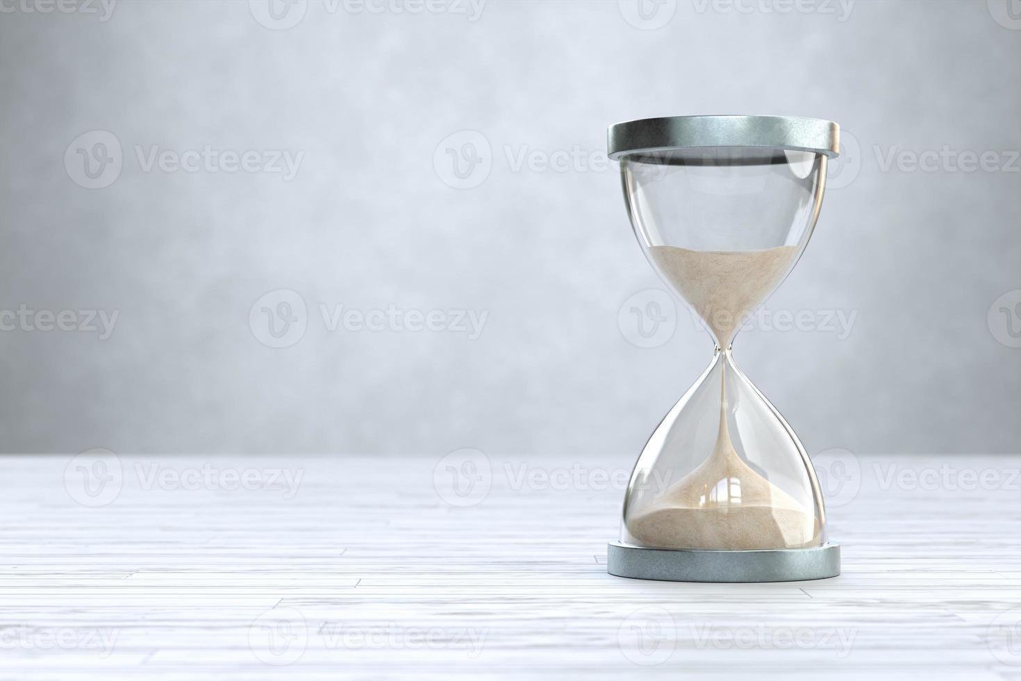 Hourglass on Wooden floor with copy space, sandglass photo