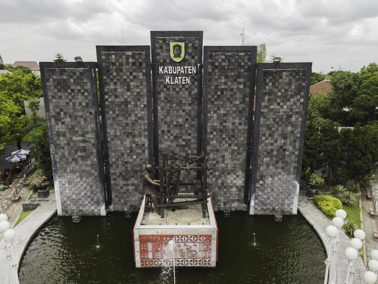 Aerial view of Batik statue in Klaten City with name sign in. Klaten, Indonesia - December 2020 photo