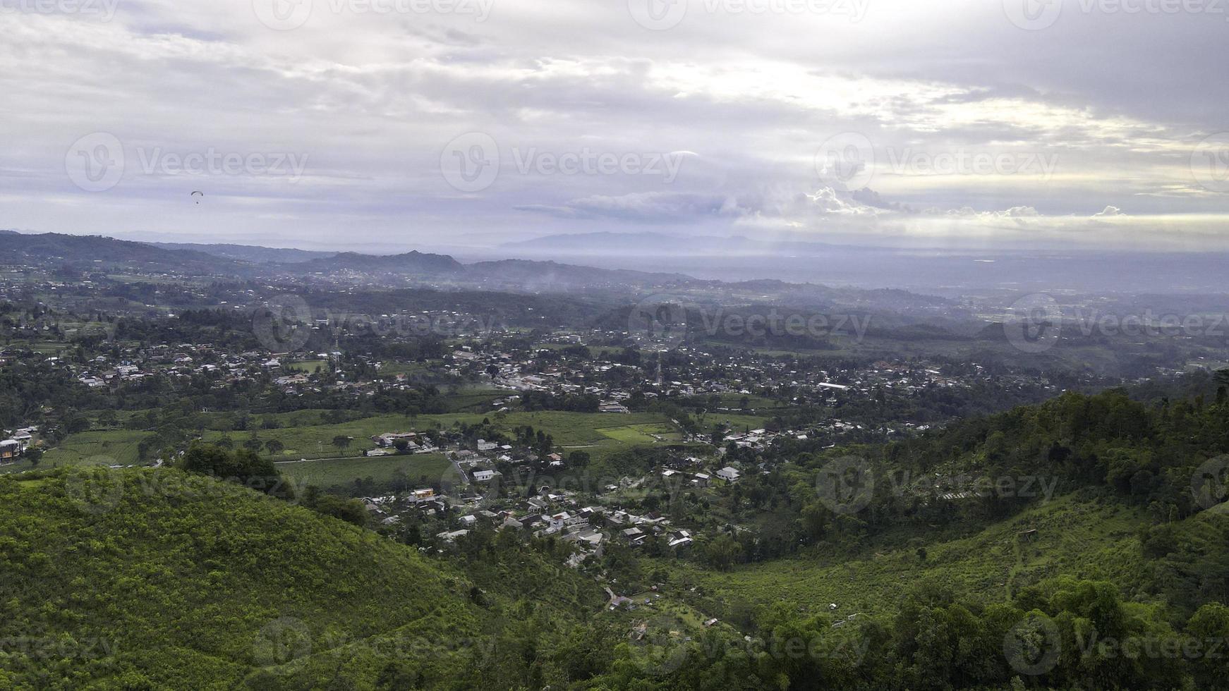 Aerial view of tea plantation in Kemuning, Indonesia with Lawu mountain background photo
