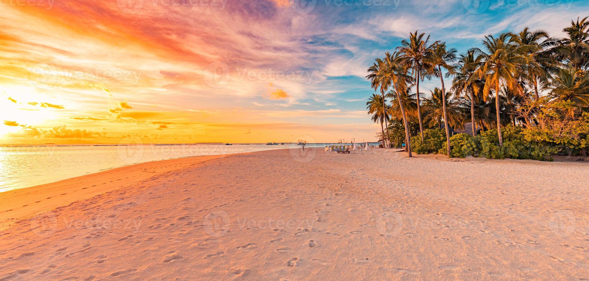 Tranquil summer vacation holiday landscape. Tropical island sunset beach. Palms shore calm sea sand. Exotic nature scenic, inspirational and peaceful seascape reflection, amazing sky sunset photo