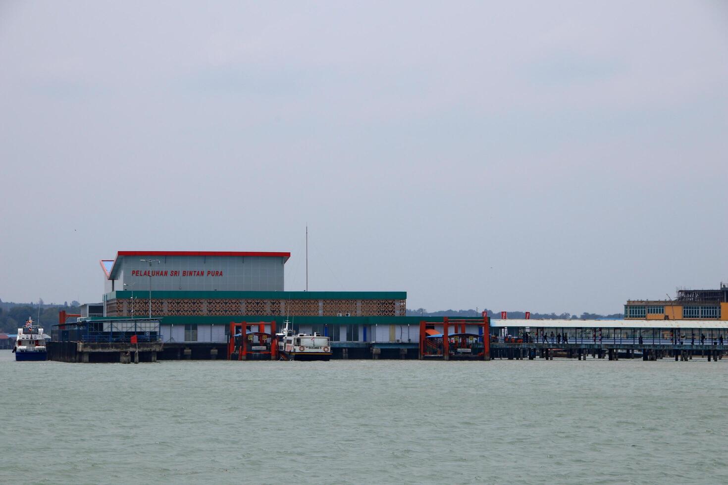 Various ship activities at the Port of Sri Bintan Pura in the city of Tanjung Pinang namely on the west coast of the island of Bintan photo