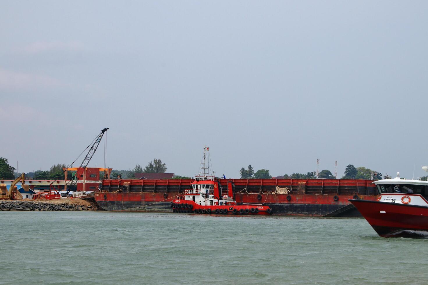 Various ship activities at the Port of Sri Bintan Pura in the city of Tanjung Pinang namely on the west coast of the island of Bintan photo