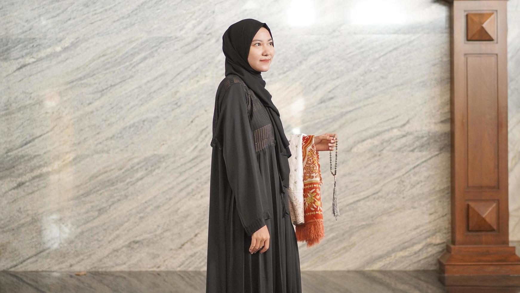 Muslim woman after worship at the mosque photo