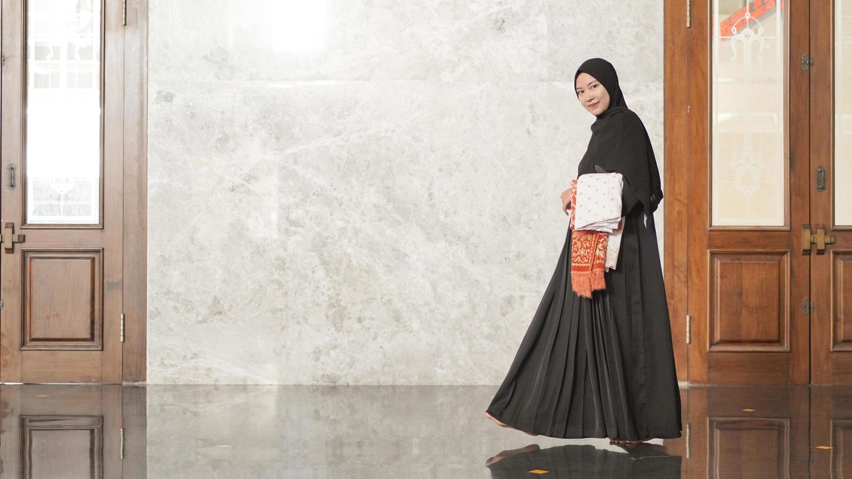 Muslim women after worship will leave the mosque photo