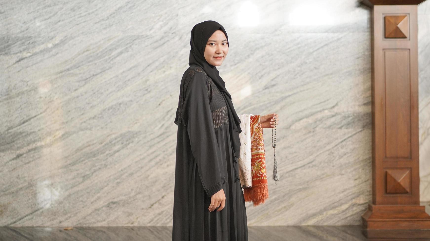 Muslim woman after worship at the mosque photo