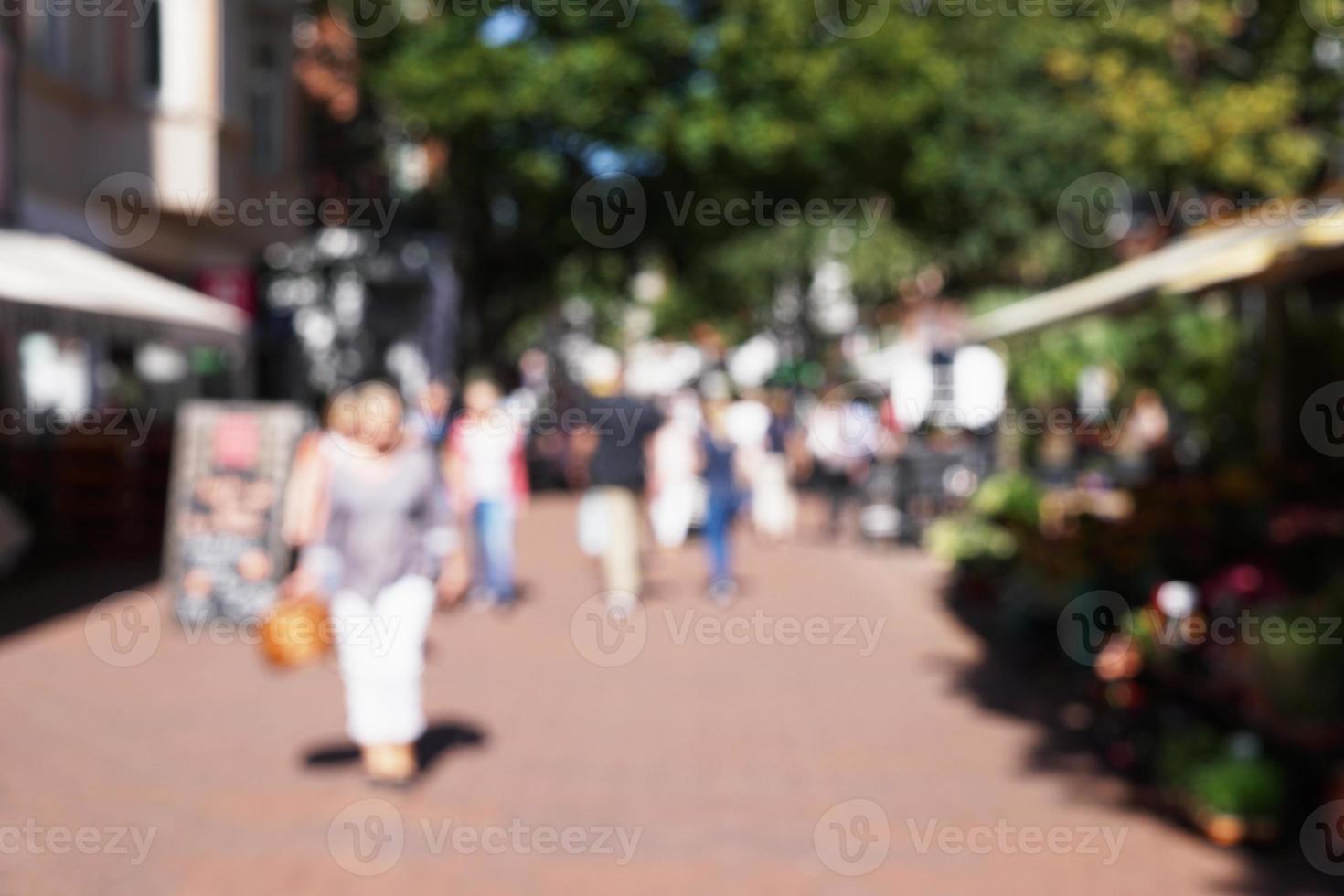 defocused pedestrian shopping street photo