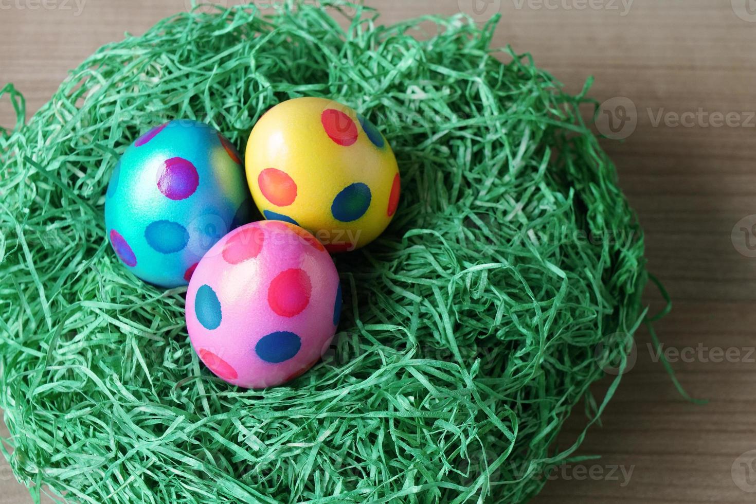 close-up easter eggs and grass decoration photo