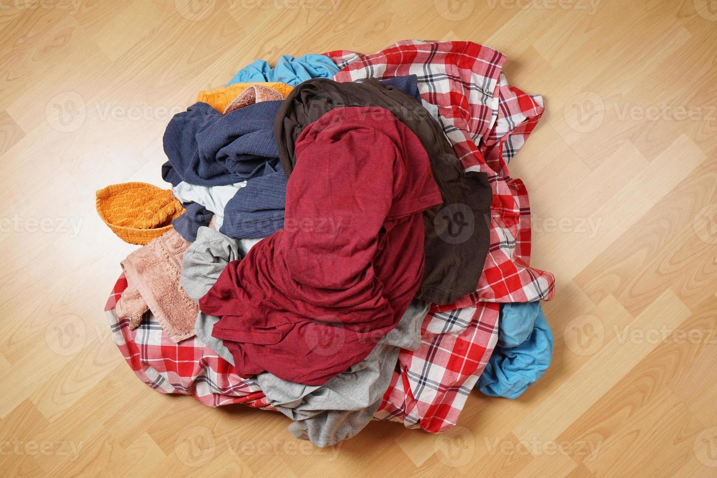 dirty laundry pile on floor photo