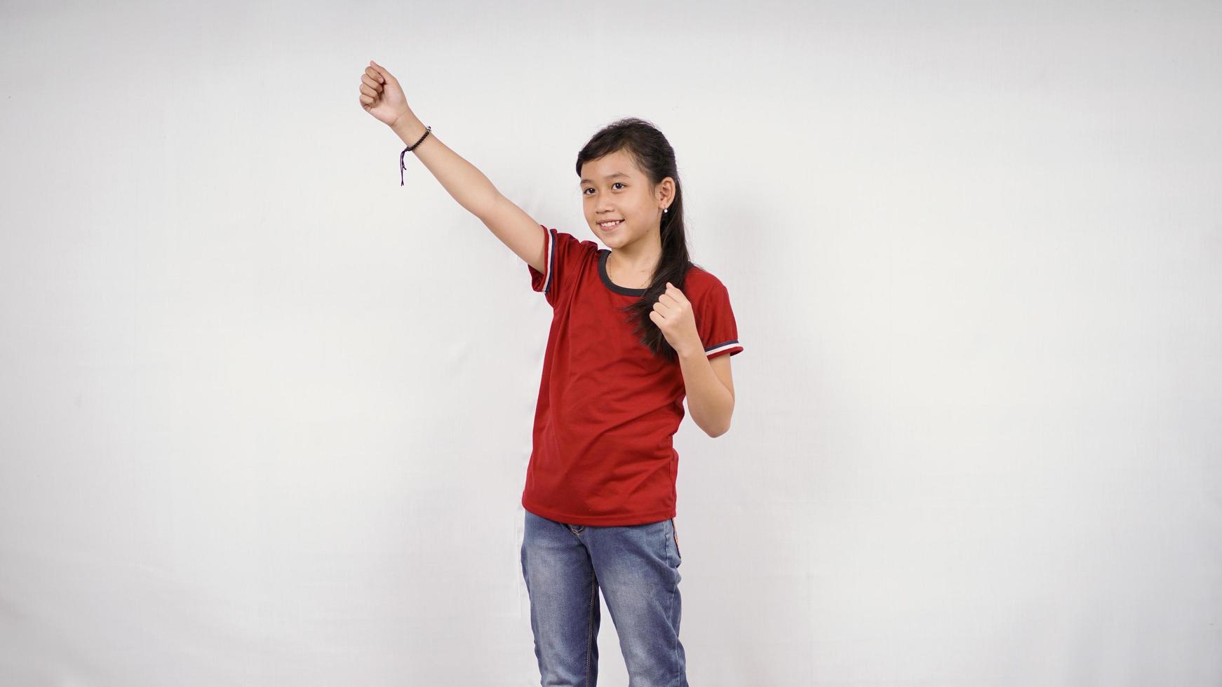 asian little girl achieve success isolated on white background photo