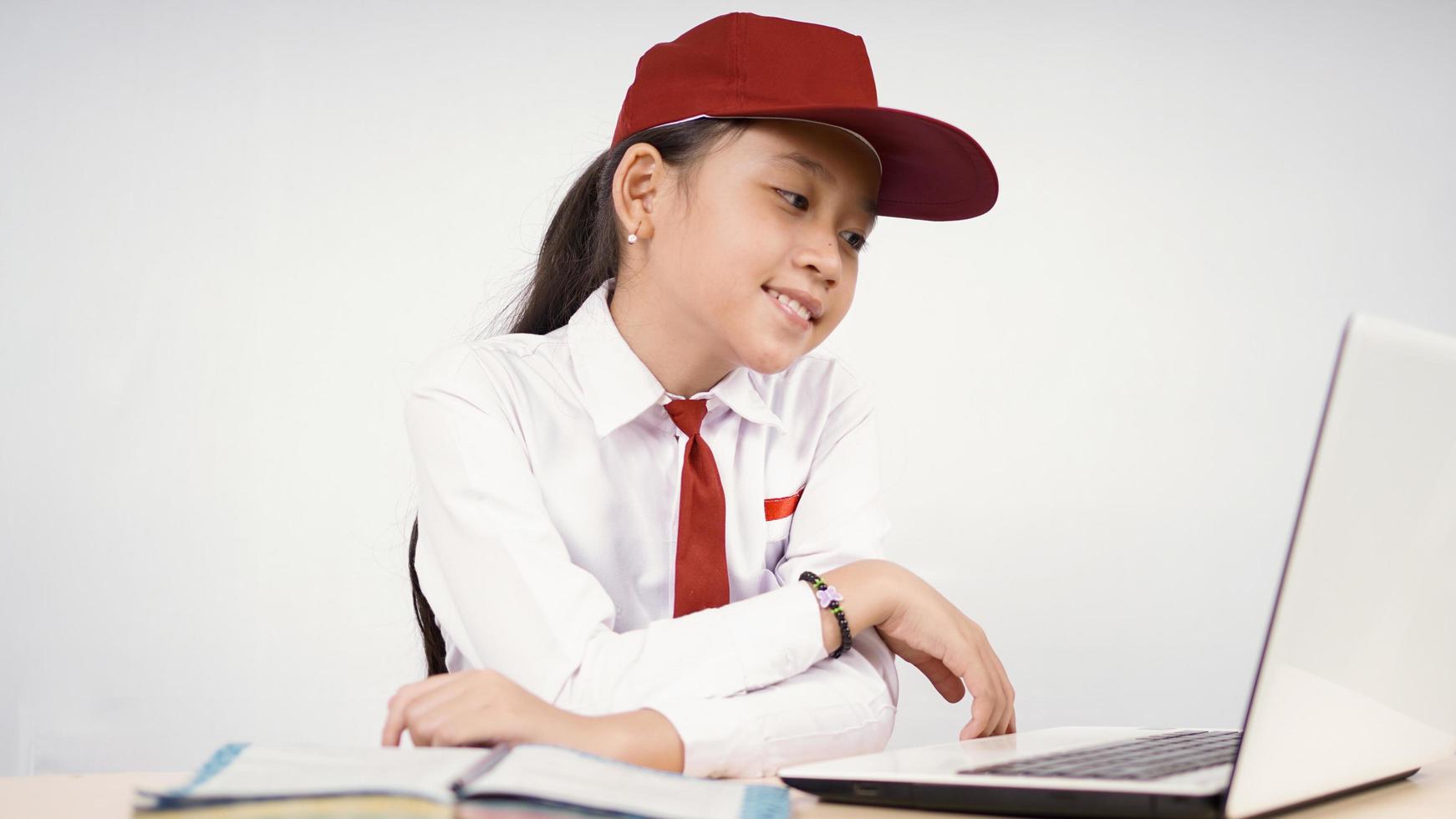 Asian elementary school girl studying enjoy isolated on white background photo