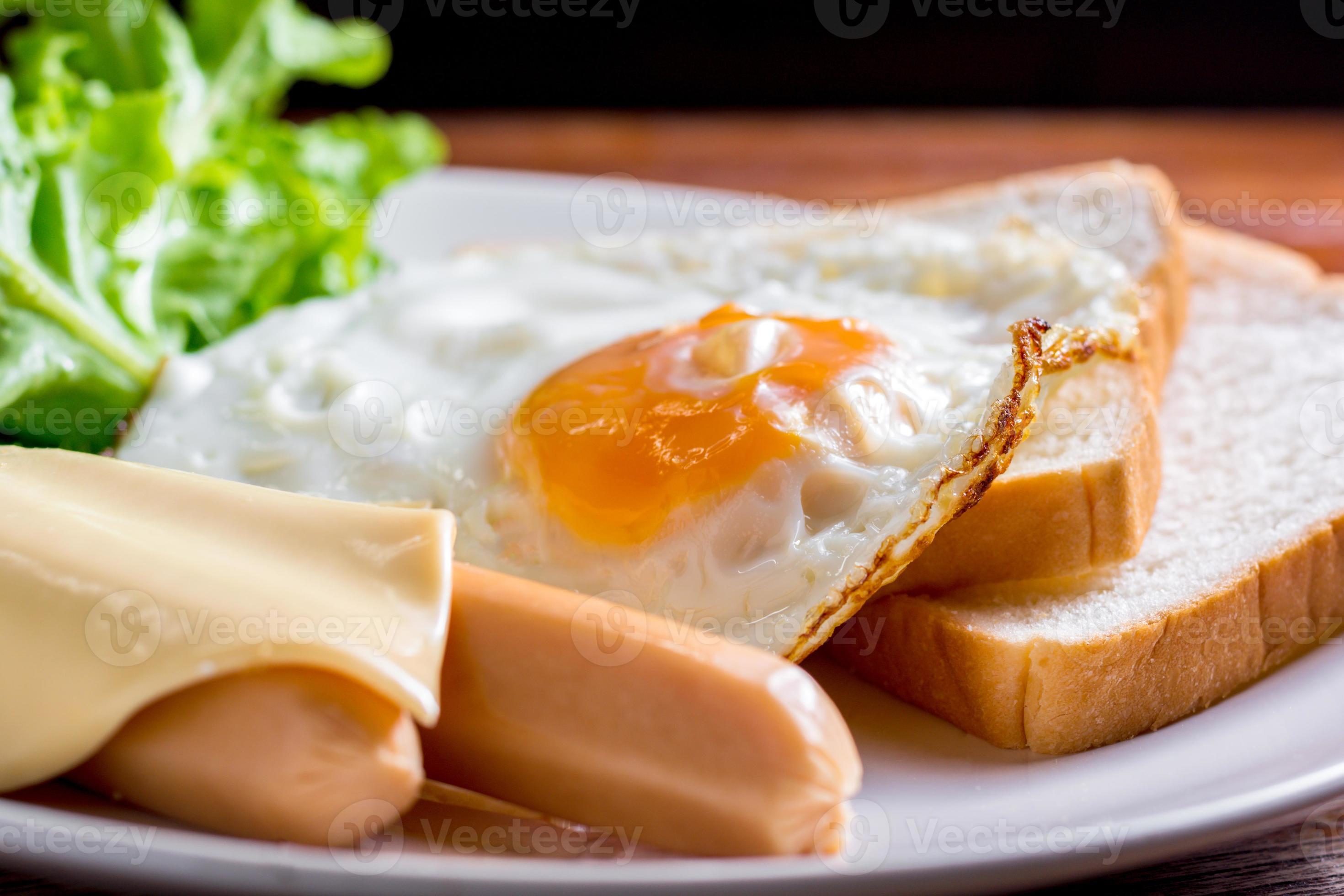 American breakfast concept. Fried egg with sliced bread, boiled chicken
