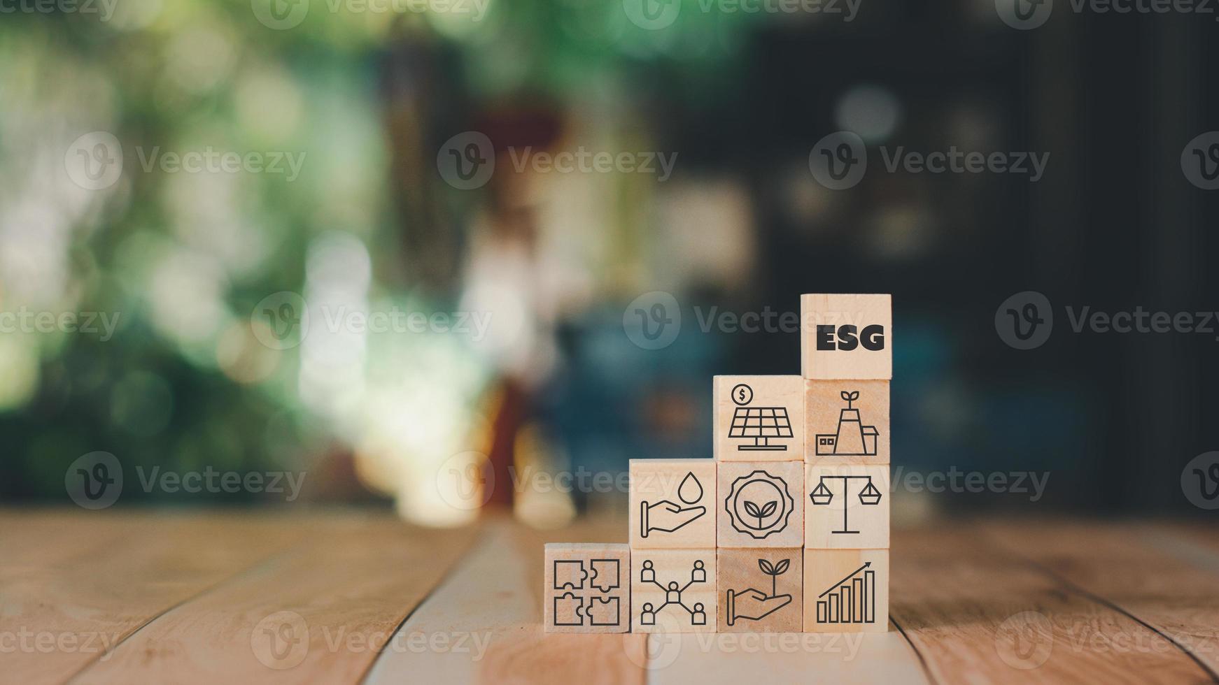 Set of environment, social, and governance ESG concept. The wooden block with thin line icons such as sustainable ecological, save water and energy, honest people. photo