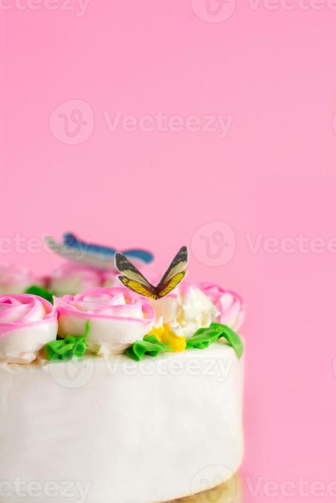 Butter cream of Pink Roses decorated oo vanilla pond cake on pink background with copy space served in Birthday Party and wedding. Delicious sweet bakery for someone you love. photo