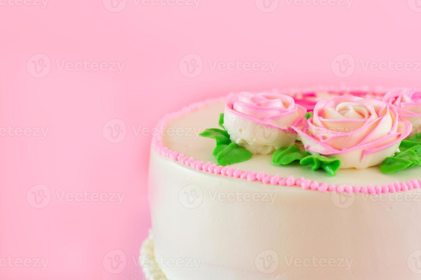 Butter cream of Pink Roses decorated oo vanilla pond cake on pink background with copy space served in Birthday Party and wedding. Delicious sweet bakery for someone you love. photo