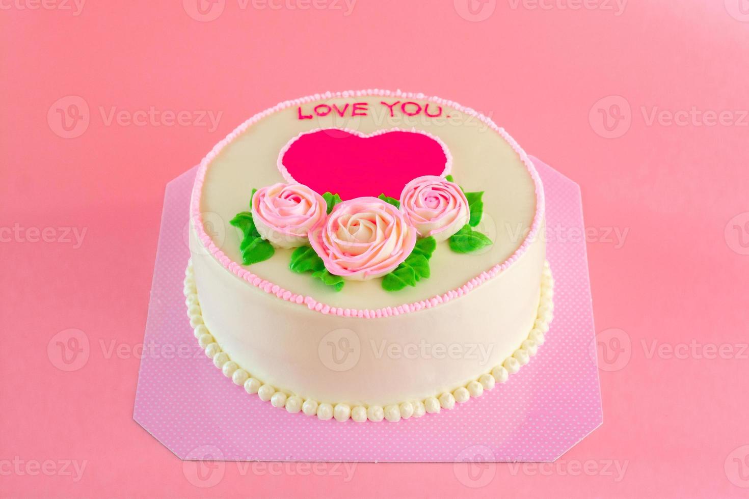 Butter cream of Pink Roses decorated oo vanilla pond cake on pink background with copy space served in Birthday Party and wedding. Delicious sweet bakery for someone you love. photo
